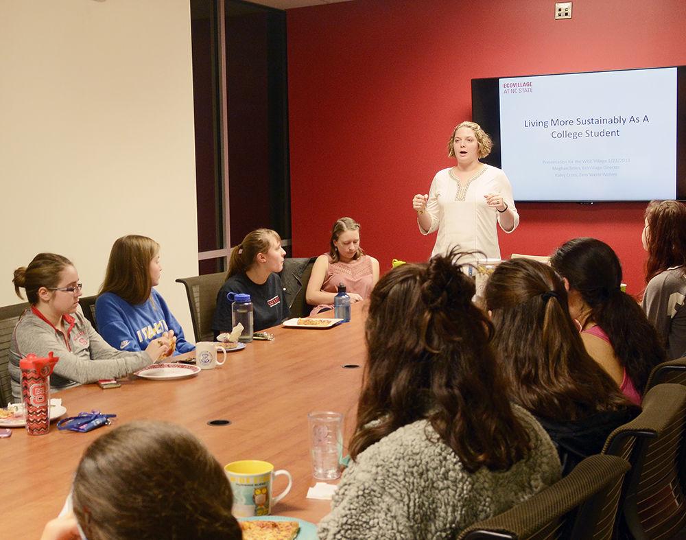 Members of the Women in Science and Engineering (WISE) Village learn about living sustainably from Meghan Teten, the EcoVillage director in Lee Hall on Tuesday. Everyone who attended the event ate pizza on reusable plates while learning ways they can incorporate sustainability into their lives.
