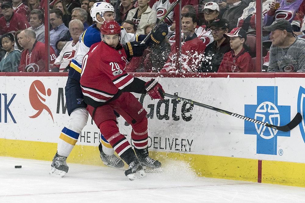 Hurricanes right wing Sebastian Aho checks a Blues defender into the boards to try and get possession of the puck. Canes drop the game to the Blues 2-1 at PNC Arena on Friday, Oct. 27 for a home record of 1-2-1. The Hurricanes are currently 7th in the Metropolitan Division.