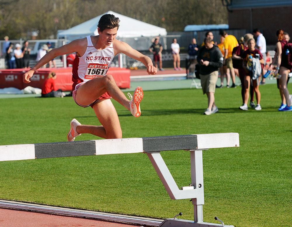 Sophomore Aaron Thomas jumps over one of the obstacles placed on the track for the 3000m men's steeplechase, a race that featured four barriers and a water jump. Thomas competed in the steeplechase at the Adidas Raleigh Relays held at Paul Derr Track on Friday, March 24, 2017, and finished sixth overall with a time of 9:13.09, just 11 seconds behind the first place finisher.