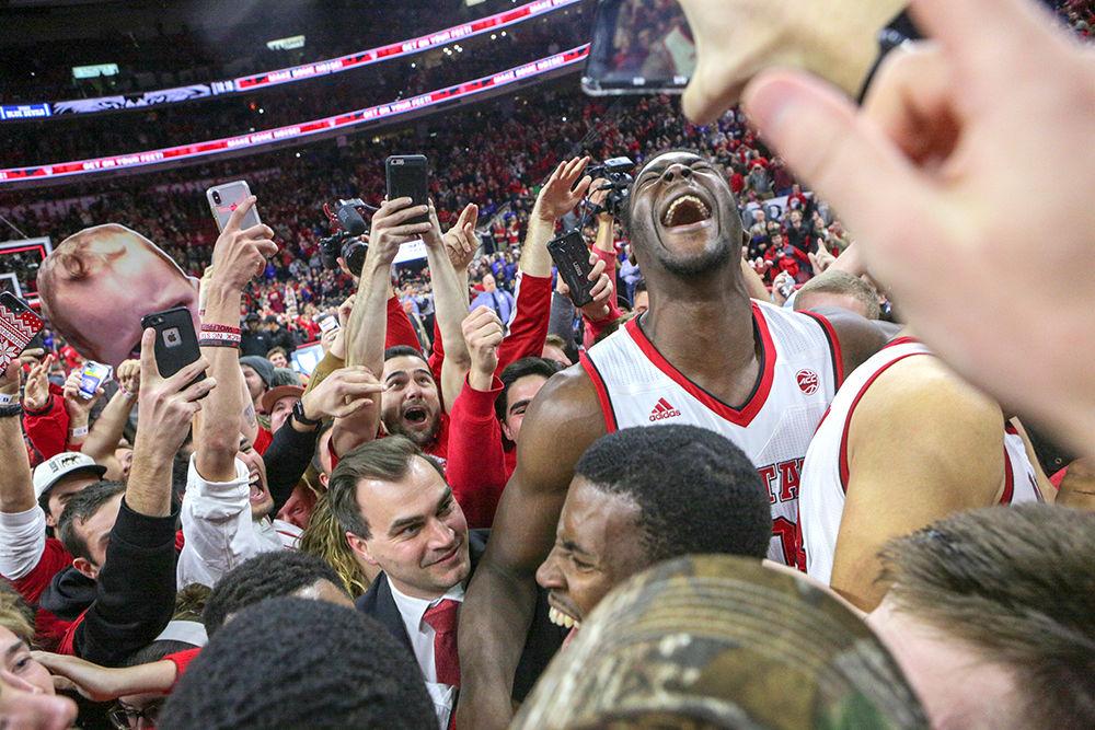 Senior forward Abdul-Malik Abu exclaims to the air as the fans jump around celebrating a 96-85 win over No. 2 Duke in PNC Arena on Saturday.