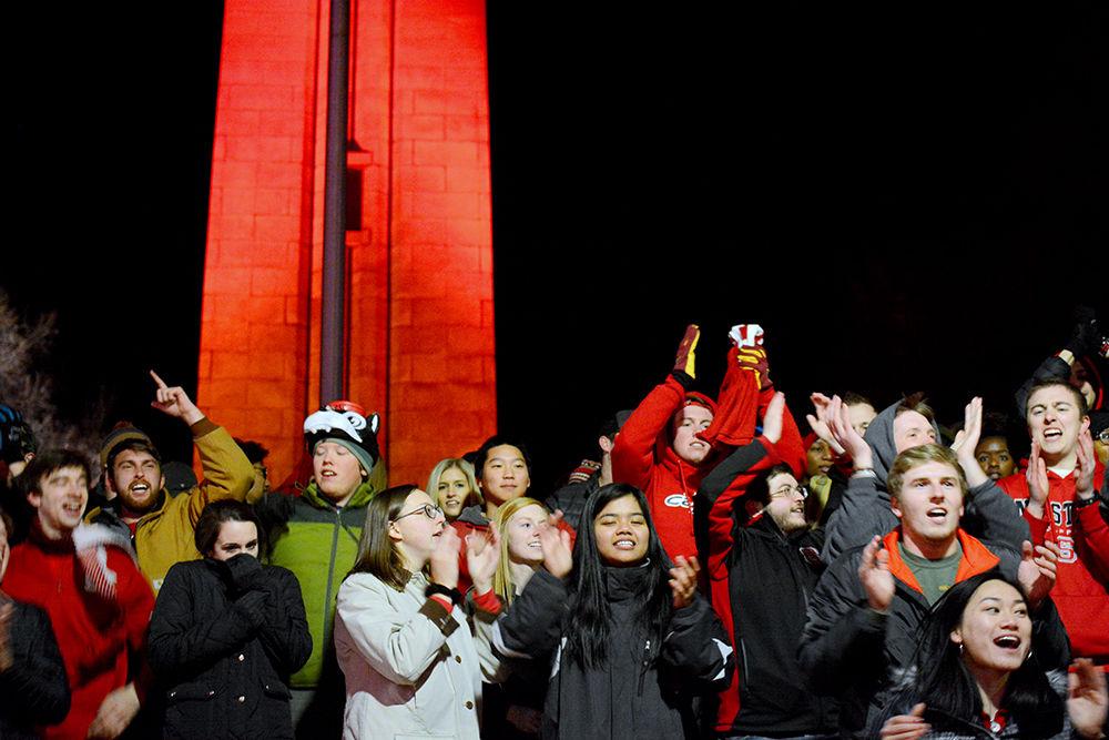 Students and others gather at the Memorial Belltower on Saturday, Jan. 6 to celebrate the NC State Men's Basketball win over Duke University. Wolfpack secured the 96-85 win at PNC Arena.