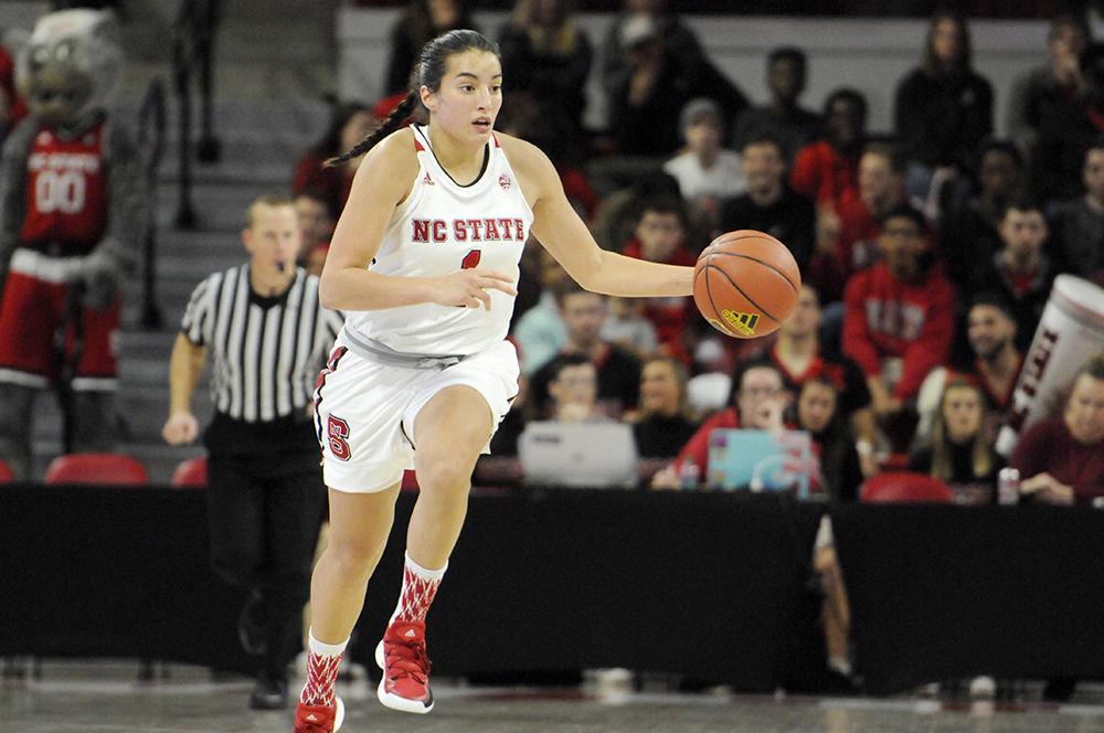 Sophomore point-guard Aislinn Konig runs the ball down the court at the N.C. State V. University of Southern Alabama women's basketball game in Reynolds Coliseum on Friday, Nov. 8. The Wolfpack women's basketball team won against the Jaguars 71-50 in a thus far undefeated normal season.