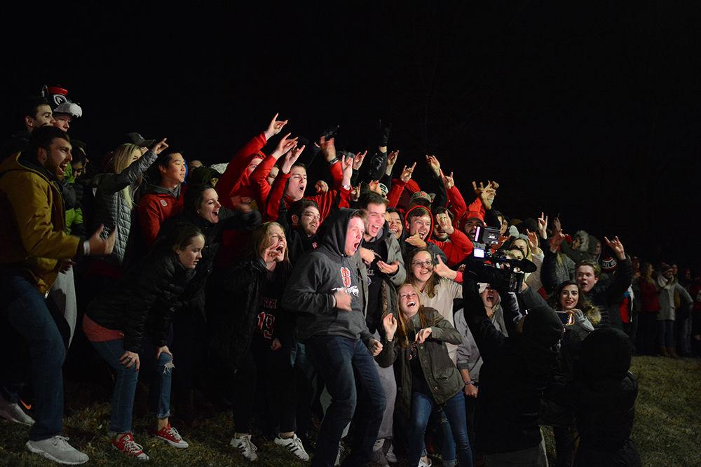 Students and others gather at the Memorial Belltower on Saturday, Jan. 6 to celebrate the NC State Men's Basketball win over Duke University. Wolfpack secured the 96-85 win at PNC Arena.