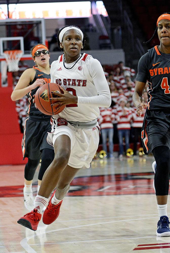 Red shirt sophomore guard Kaila Ealey drives to the basket in Reynolds Coliseum on Sunday. Ealey scored 11 points in the 60-56 win against Syracuse, head coach Wes Moore's 100th win with the Wolfpack.
