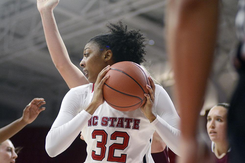 Senior center Akela Maize posts up with the ball against Lee University. Maize led the team with 13 points scored in 17 minutes of action. The Wolfpack would go on to win 57-42 in Reynolds Coliseum on Nov. 2.