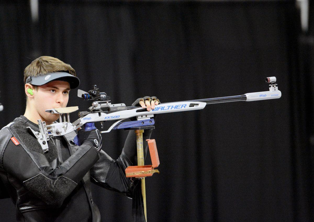 Zach Eisenburg, a second-year studying management, prepares to take another shot during the small-bore portion of NC State's rifle match against The University of Akron. The match took place at Reynolds Coliseum on Saturday. Eisenberg scored 576 points in small-bore, contributing to the Wolfpack's overall 4656 to 4642 win against Akron.