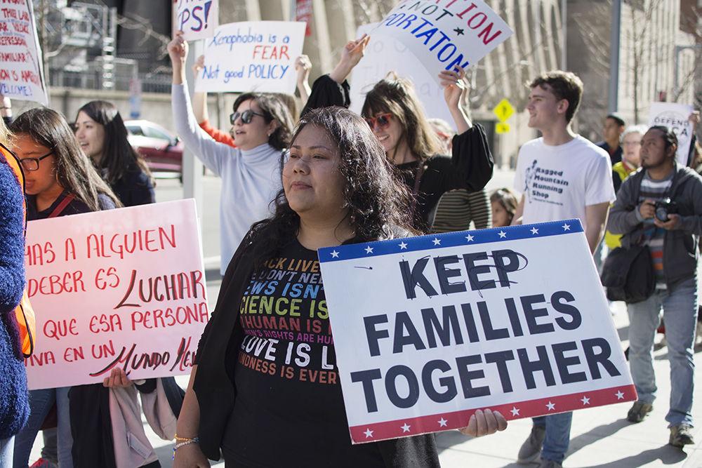A woman marches alongside others during Sanctuary Everywhere, starting at the Wake County Justice Center and ending at the North Carolina State Capitol in support of immigrant rights on Saturday. Sanctuary Everywhere Raleigh was organized by Wolfpack Students for Immigrant Rights and Equality on behalf of the many immigrants in North Carolina that fear deportation or separation from their families.