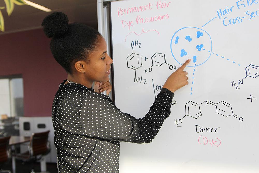 Tova Williams, a fourth-year Ph.D. student studying fiber and polymer science, describes how temporary and permanent dyes chemically react in hair. Williams does research into the design of less toxic hair dyes. "As an undergrad here at State, my classes were focused on color as well as polymers. I learned about dyes and learned that some of them are toxic to the environment as well as to humans. At the time I was dying my hair and so was my mom, who still does. Long story short it hit home. I was like 'wow we're using these dyes who are toxic to not only consumers but hair stylists and manufacturers.' I just want to make a change and help design less toxic hair dyes."