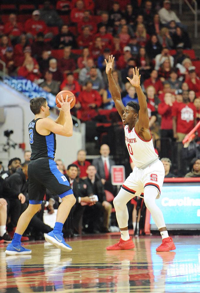 Abdul-Malik Abu, a senior forward, guards Grayson Allen at the 3 point line. The North Carolina State University mens basketball team caught a win against 4th ranked Duke saturday night 96-85.