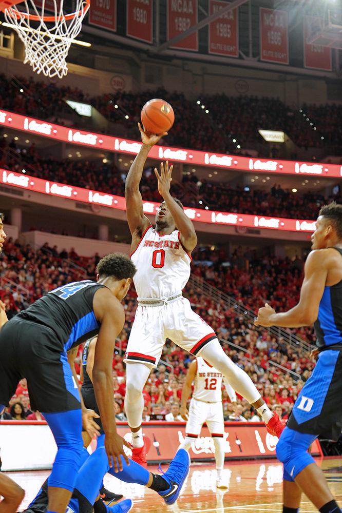 Abdul-Malik Abu, a senior forward, draws the foul for the and-1. The North Carolina State University mens basketball team caught a win against 4th ranked Duke saturday night 96-85.