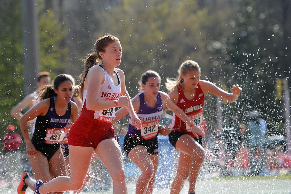 Sophomore Rachel Bartolomeo leads a pack of runners out of the water jump during the 3000m steeplechase at Paul Derr Track on Friday, March 24, 2017. Bartolomeo was one of many NC State athletes who competed at the Adidas Raleigh Relays held Friday and Saturday, March 24-25, 2017, but was the only female who competed for the Wolfpack in the women's 3000m steeplechase.