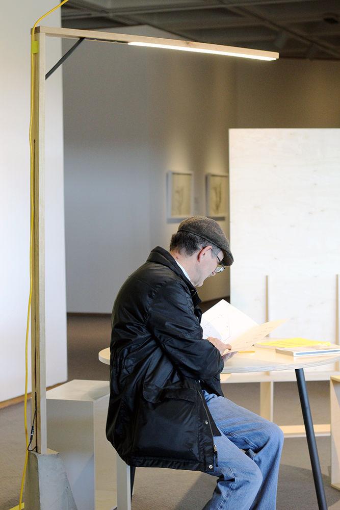 Rob Harris, NCSU alumnus, is sitting at one of the interactive pieces featured in the Ideal Space exhibit on Sunday at the North Carolina Museum of Art. Harris stumbled upon the exhibit while looking for his favorite painting. The Ideal Space exhibit is an installation by College of Design students and runs through Jan. 25.