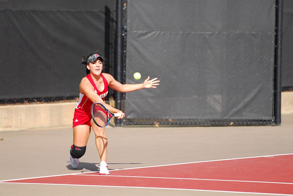Sophomore Claudia Wiktorin returns the ball to opponent Sydney Riley from Clemson University in the N.C. State tennis match on Fri. Mar. 31st. 2017. Wiktorin ended with a victory over her opponent after three sets scoring 7-5, 6-7, and 10-5 respectively. The Wolfpack prevailed over the Clemson Tigers with a final score of 6-1.