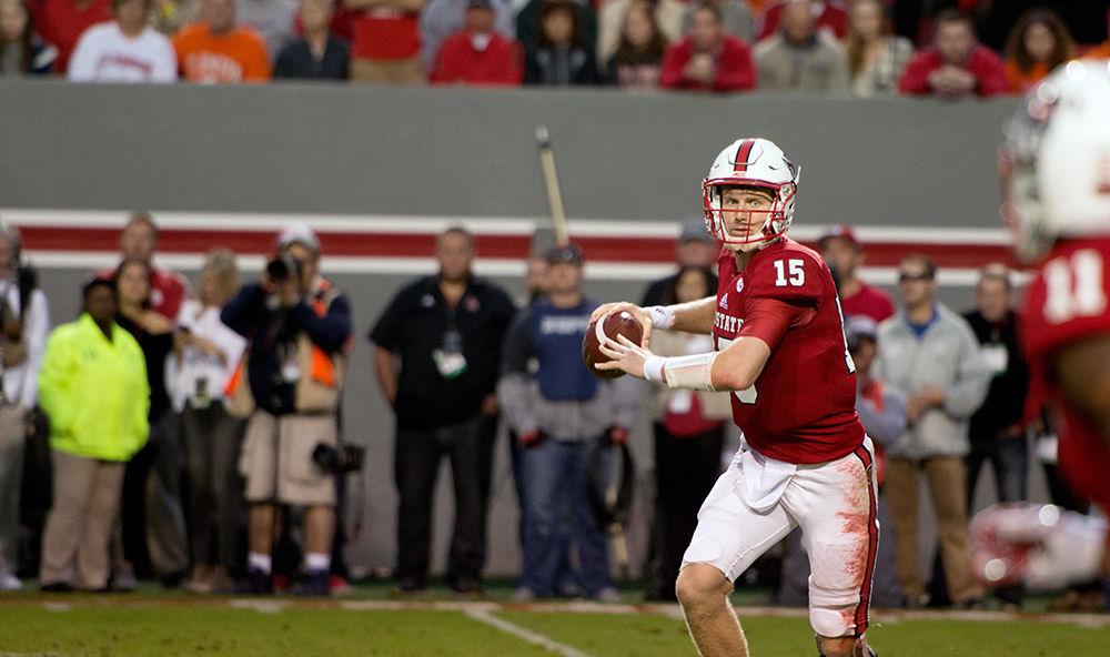 Redshirt junior quarterback Ryan Finley prepares to rifle a screen pass to redshirt sophomore wide receiver Jakobi Meyers. Finley threw for a total of 338 yards and three touchdowns in the 38-31 loss to Clemson on Saturday at Carter-Finley Stadium.