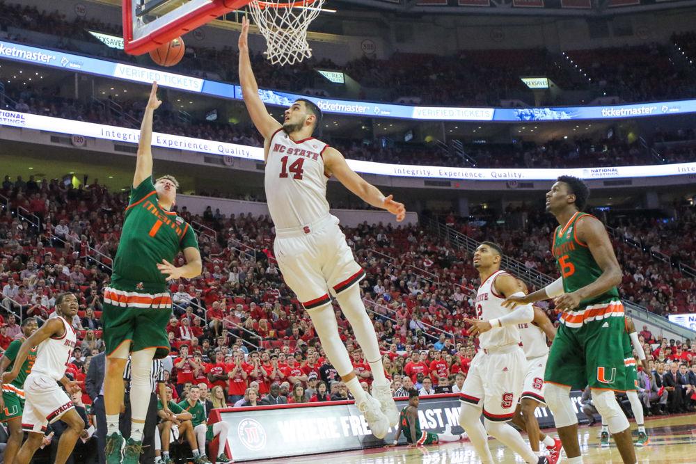 Sophomore center Omer Yurtseven goes up for a block. Yurtseven lead the team in points with 28 and blocks with two during the 86-81 loss to Miami on Thursday, Jan. 21 in PNC Arena.