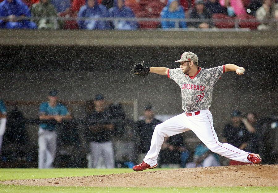 Sophomore pitcher Brian Brown pitches in the rain on Doak Field at Dail Park on June 6, 2016. Brown pitched four innings allowing three runs on three errors. NC State lost the battle against weather, fatigue and Coastal Carolina 7-5.