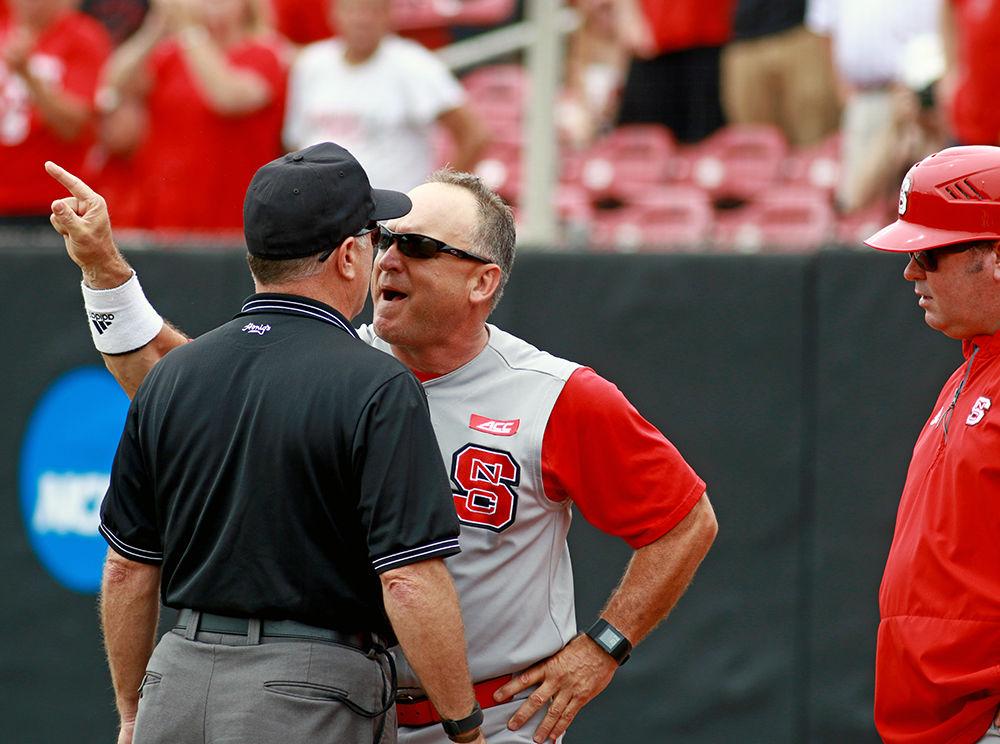 Head coach Elliott Avent gets right up in the face of the umpire after being thrown out of the game in the third inning of the Wolfpack's fourth game of the NCAA Raleigh Regional against Coastal Carolina on June 6, 2016. Avent was ejected from the game for arguing balls and strikes and faced a two-game suspension. The Wolfpack routed the Chanticleers 8-1 at Doak Field to force a winner-take-all game.