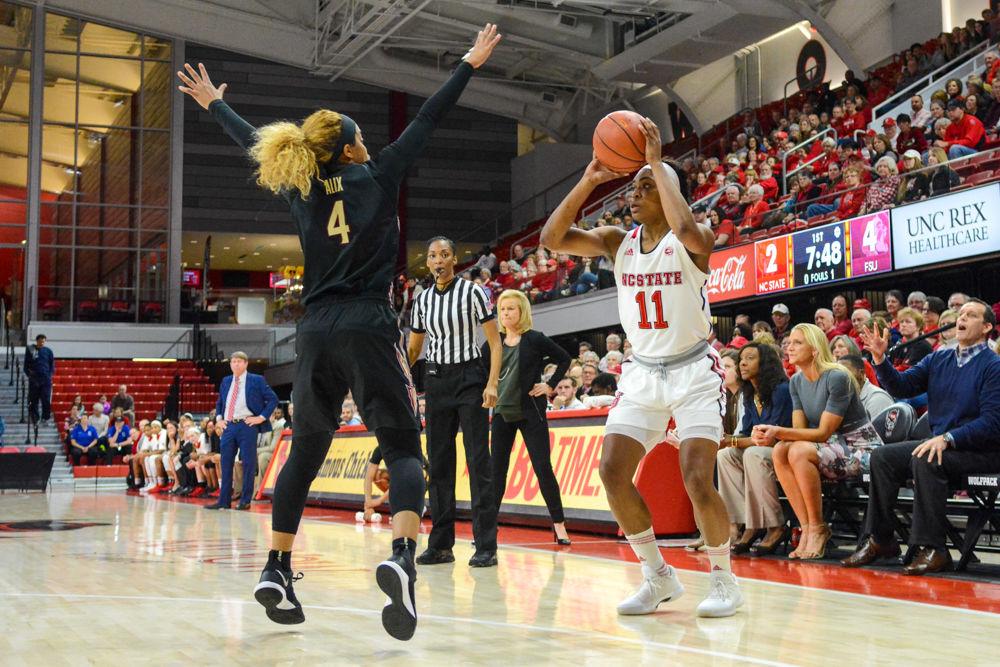 Redshirt junior guard, Kiara Leslie goes up for a 3-point shot during the game against Florida State. Leslie scored a total of 16 points for the Wolfpack with three 3-pointers made. The Wolfpack won the game against the Seminoles by a score of 65-56 at Reynolds Coliseum on Thursday, Feb. 1.