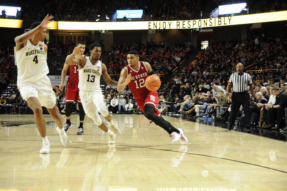 Graduate student guard Allerik Freeman runs past the defense of Wake Forest University at the NC State vs. Wake Forest men's basketball game hosted at Wake Forest University in the Lawrence Joel Veterans Memorial Coliseum on Saturday. The Wolfpack won against the Demon Deacons with a final score of 90-84.