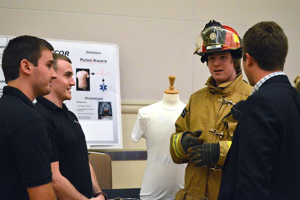 Jack Dodd, a fourth-year studying electrical engineering and CEO of Rhythcor, explains PulseAware during the LuLu eGames Reception in Talley Mountains Ballroom on April 20, 2017. Rhythcor delevoped PulseAware, a device that aims to combat heart attacks suffered by firefighters by monitoring their heart, detecting signs of a heart attack, and alerting emergency services when necessary. Rhythcor won several categories of awards.&#160;