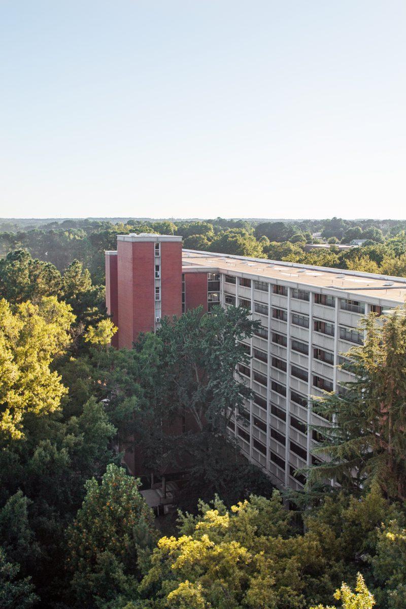 The setting sun illuminates Lee Residence Hall on Tuesday. University Housing was not prepared this August as they welcomed back an estimated 300 applicants above their original housing allotment.