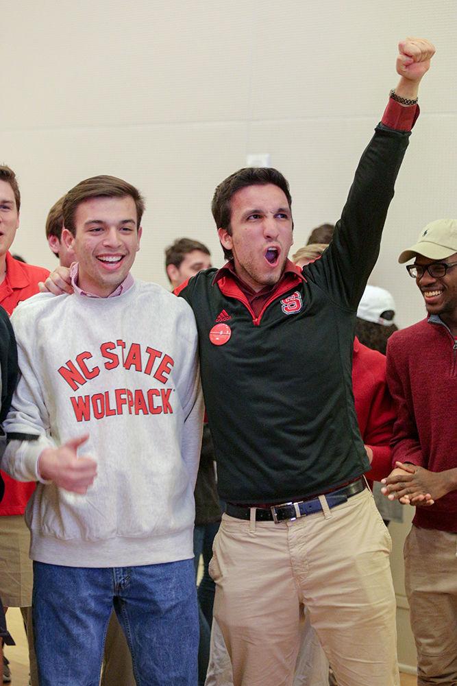 Third-year statistics student and student body vice presidential candidate Zach Lewis and fourth-year aerospace engineering student and student body presidential candidate Alberto Quiroga begin to cheer during the election reveals in the Mountain Ballroom of Talley Student Union on Tuesday. Quiroga and Lewis will be facing fourth-year mechanical and aerospace engineering student Jess Errico and fouth-year entomology Ph.D. student Meredith Spence Beaulieu in the runoff to be held on Thursday.