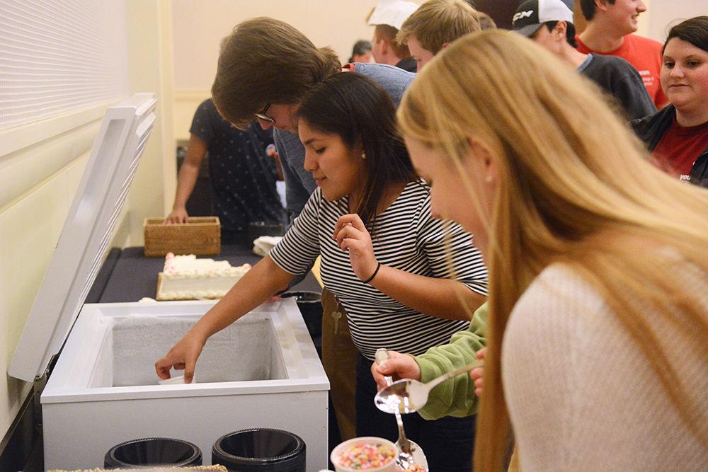 Aitana Blevins, a freshman in the College of Engineering, reaches out for Howling Cow ice cream, served at the revealing of the Election Results on Tuesday. The results were unveiled at Talley Student Union, after a lot of campaigning and a debate hosted by Student Media.
