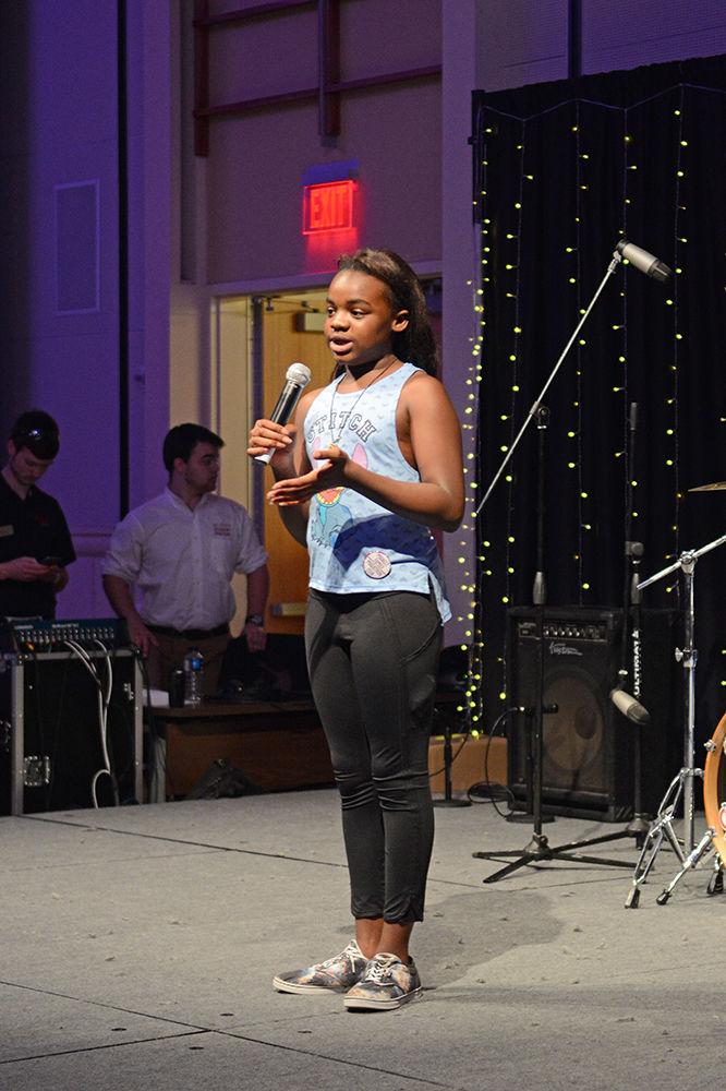 Ryan Thomas, one of the Miracle Children who attended NC State's Dance Marathon, talks about how she and her grandmother make hats to give to patients at Duke Children's Hospital during Dance Marathon on Saturday. Miracle Children are survivors of pediatric illness or injury. Dance Marathon is an annual 12-hour event for which participants raise money for Duke Children&#8217;s Hospital.