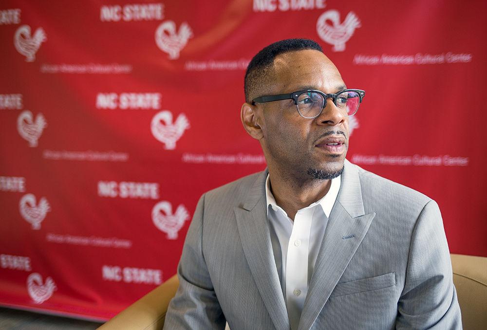 Moses T. Alexander Greene poses in front of the African American Cultural Center. Greene is the new director of the AACC, following the interim director, Frances Graham.