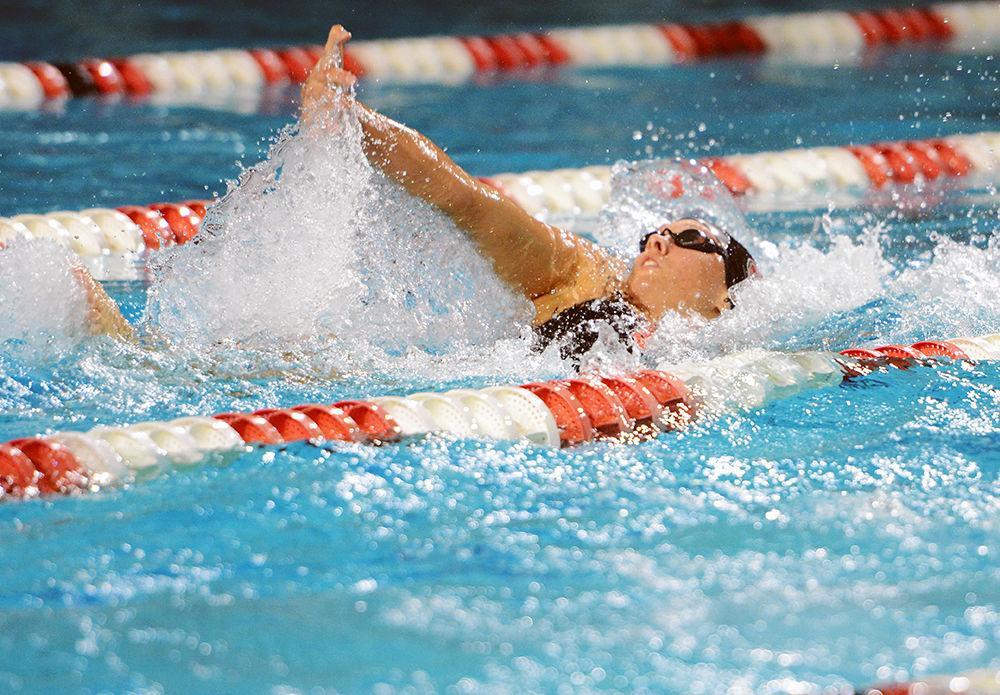 Junior Elise Haan swims backstroke during the meet against Texas. Haan and the Wolfpack women&#8217;s swimming and diving team lost 184-116 to the Longhorns in Willis R. Casey Aquatic Center on Nov. 10.