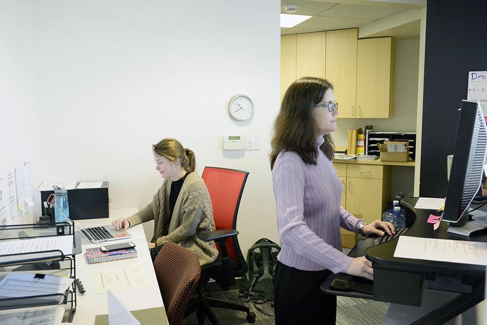 Administrative advisor Heather Dellinger and student intern Madisen Anderson check in students in the lobby of the Career Development Center. The Career Development Center is currently offering online services, like workshops and advising appointments.