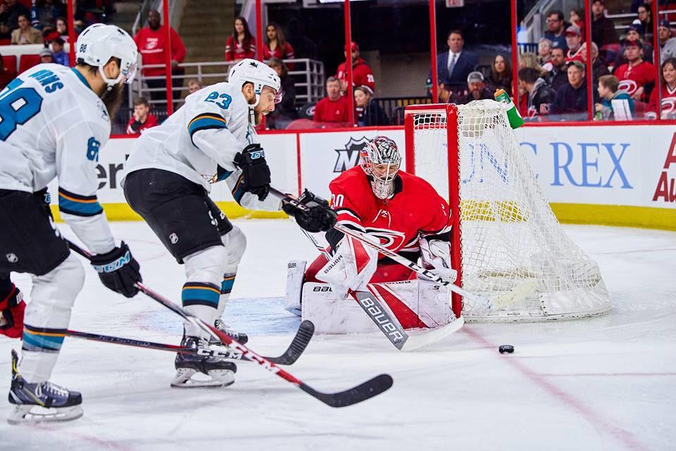Hurricanes goalie Cam Ward follows an attempt on goal by Barclay Goodrow and Brent Burns at PNC Arena on Sunday for a 3-1 San Jose&#160;victory. This is the second straight loss for the Hurricanes during this homestretch.