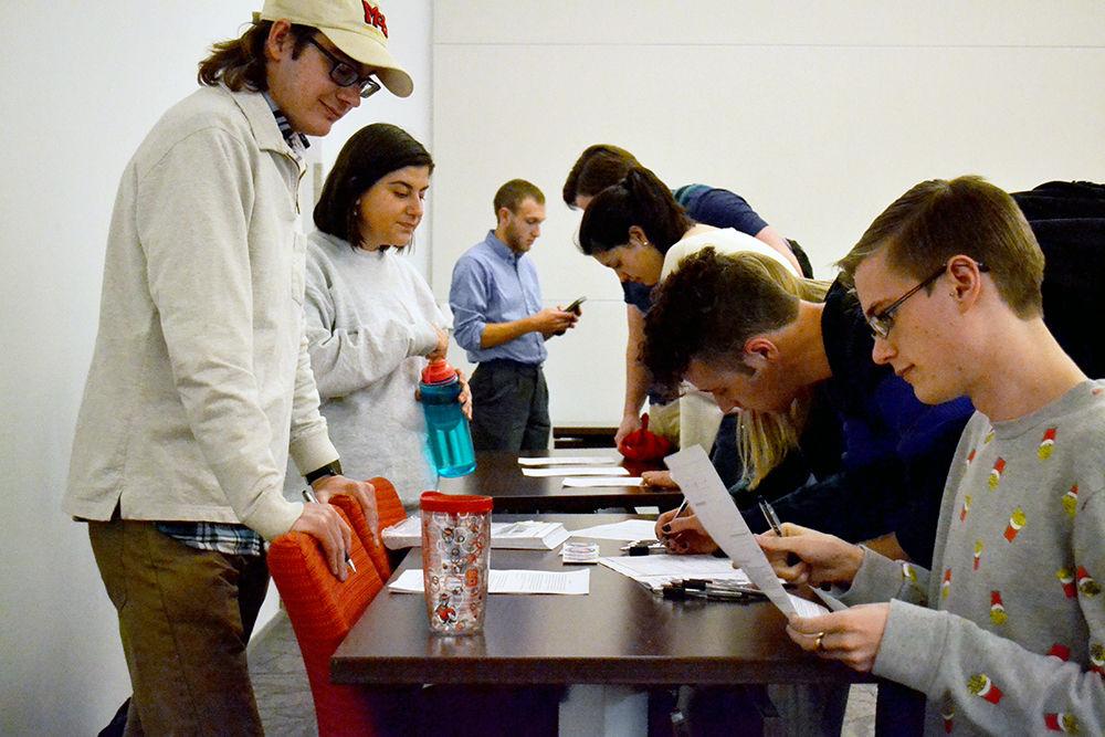 Students at the Voting Jamboree in Talley Student Union hosted by the student government learn about the candidates in their voting districts on Monday.