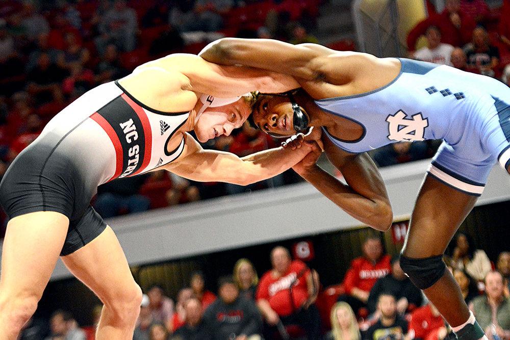 Redshirt freshman Hayden Hidlay fights against UNC's&#160;Kennedy Monday&#160;on Friday, Feb. 9 in Reynolds Coliseum. The Wolfpack beat the No. 24 Tar Heels 26-7 to improve to 14-1 overall and 4-0 in the ACC.