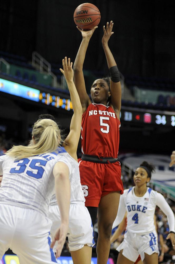 Senior forward Chelsea Nelson shoots the ball at the ACC women's basketball quarterfinal against Duke University in Greensboro Coliseum on Friday, Mar. 2, 2018. The Wolfpack was victorious against the Blue Devils with a final score of 51-45.