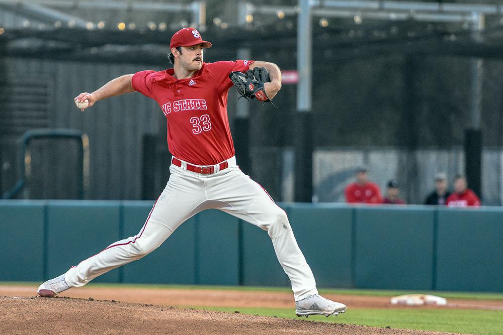 Graduate student pitcher Johnny Piedmonte hurls the ball towards the Georgia Tech batter during the double-header game on Friday, March 23, 2018 in Doak Field at Dail Park. During the second game vs the Yellow Jackets, Piedmonte pitched six shut-out winnings leading to the 5-2 win for the Wolfpack.