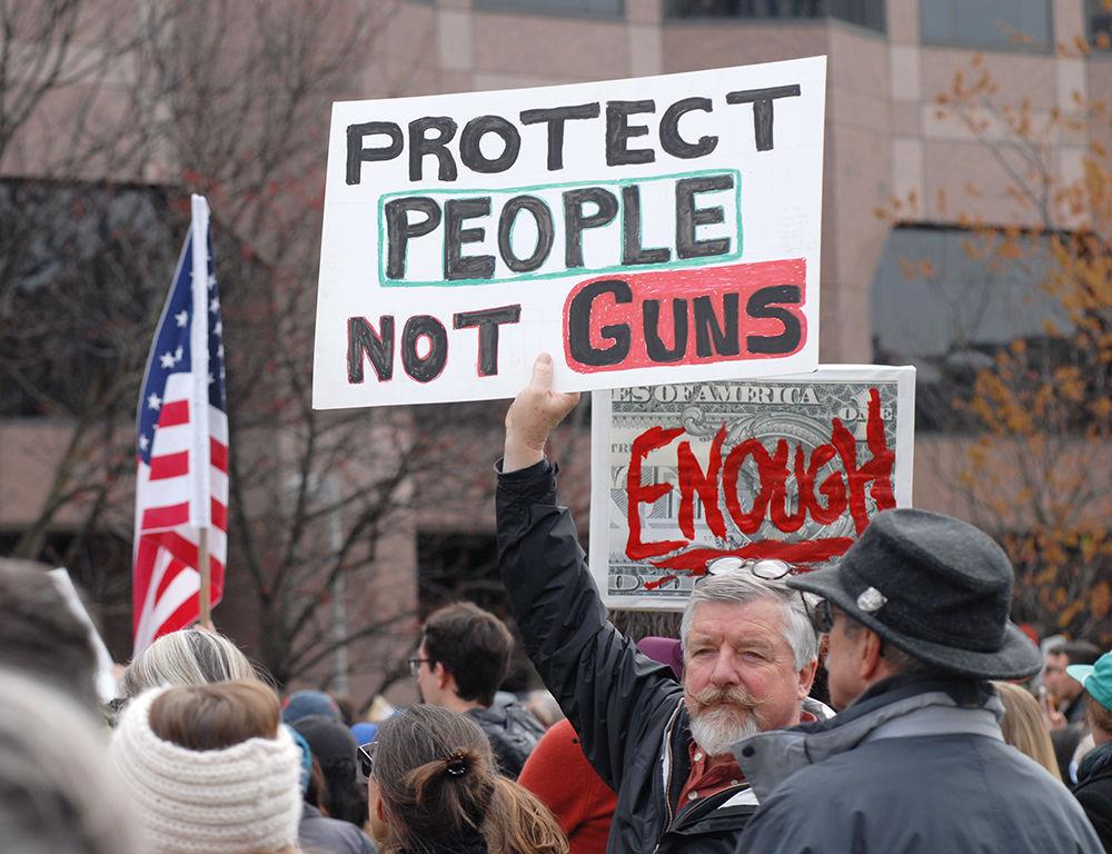 Protesters hold up signs on Halifax mall at the "March for Our Lives" in downtown Raleigh on Saturday, March. 24, 2017. The protest called for "common sense gun reform" in the wake of the multitude of mass shootings that have taken place in the United States school system.