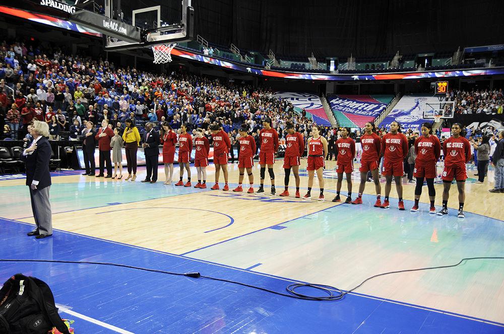 The N.C. State women's basketball team stands on the court for the national anthem at the ACC women's basketball quarterfinal against Duke University in Greensboro Coliseum on Friday, Mar. 2, 2018. The Wolfpack overcame the Blue Devils resulting in a 51-45 victory.