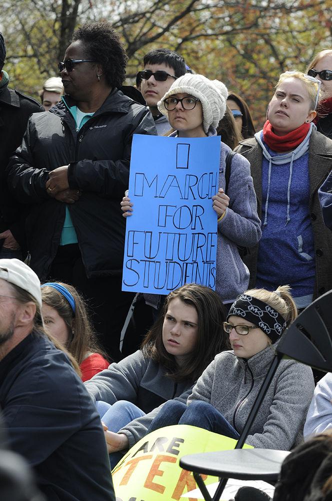 Protesters hold signs and listen to the protest speakers at the "March for Our Lives" in downtown Raleigh on Saturday, March. 24, 2017. The protest called for "common sense gun reform" in the wake of the multitude of mass shootings that have taken place in the United States school system.