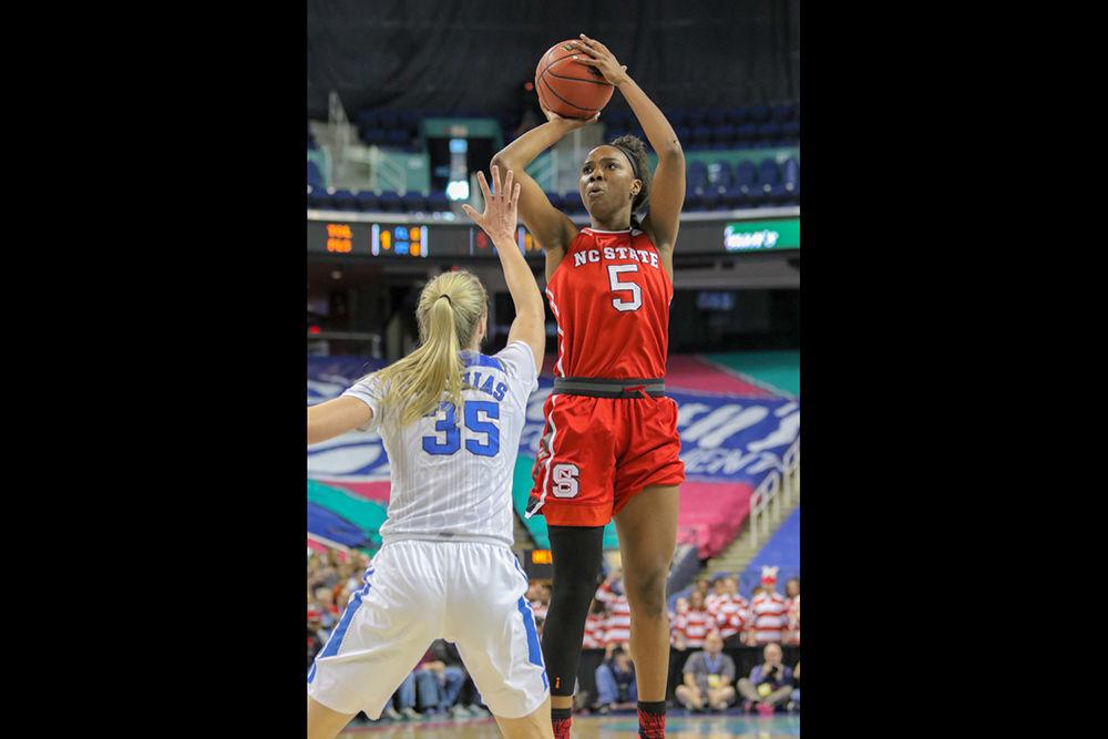 Senior forward Chelsea Nelson goes up for a jumper early in the first quarter. Nelson had a monster day with an ACC record 22 rebounds to go along with 15 points, two assists, two blocks and a steal. The Pack struggled in the third quarter, but were able to hold the lead from the first quarter until the end of the game, coming away with a 51-45 nail biter over Duke on Friday, March 2 in Greensboro Coliseum.