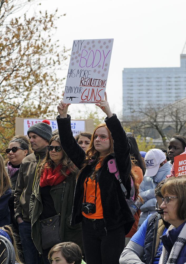 Protesters hold signs and listen to the protest speakers at the "March for Our Lives" in downtown Raleigh on Saturday, March. 24, 2017. The protest called for "common sense gun reform" in the wake of the multitude of mass shootings that have taken place in the United States school system.