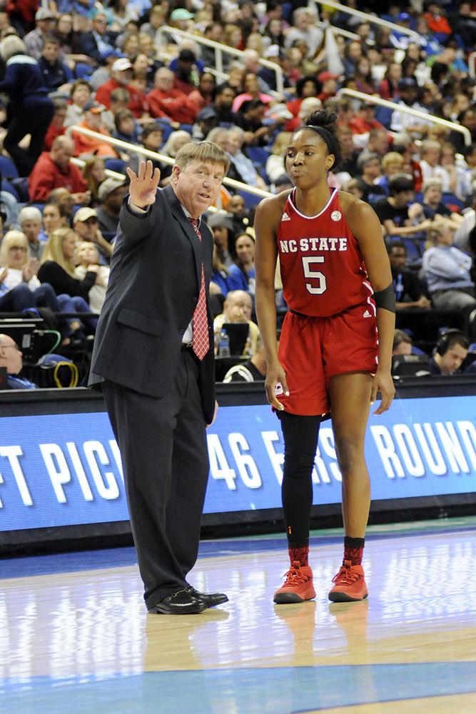 Head Coach Wes Moore coaches senior forward Chelsea Nelson at the ACC women's basketball quarterfinal against Duke University in Greensboro Coliseum on Friday, Mar. 2, 2018. The Wolfpack was victorious against the Blue Devils with a final score of 51-45.