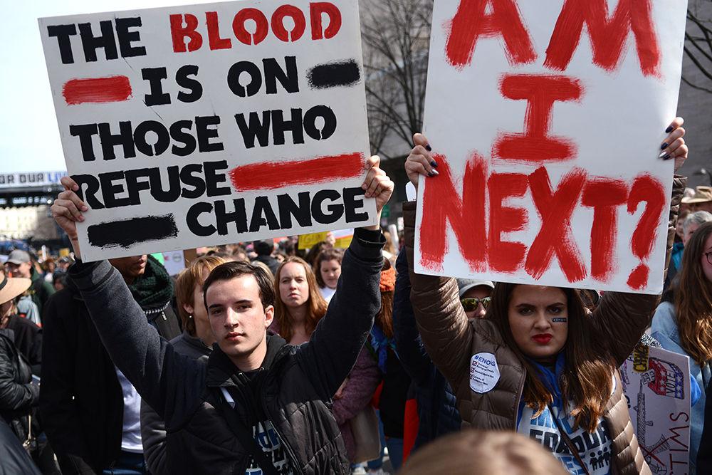 Protestors at the March for Our Lives event in Washington D.C. held signs advocating for stricter gun laws. The march, held on March 24, was partially organized by survivors of the Marjory Stoneman Douglas High School shooting, which occured on Feb. 14 and resulted in the death of 17 students and faculty.