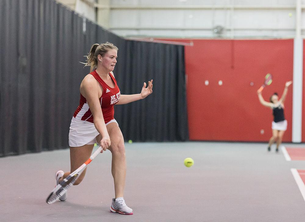 Anna Rogers dives to return a volley at the NC State vs App state women&#8217;s tennis match in the J.W. Isenhour Tennis Center on Saturday. In the morning game the Wolfpack beat the Mountaineers with a final score of 6-1.