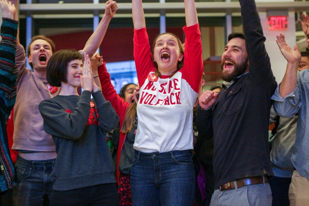 Vice President elect Meredith Spence Beaulieu, a fourth-year Ph.D. studying entomology, president elect Jess Errico, a fourth-year studying mechanical and aerospace engineering, and James Withrow, a fourth-year Ph.D. student studying biology all cheer at the announcement of their election on Thursday, March 1 in Talley Student Union.