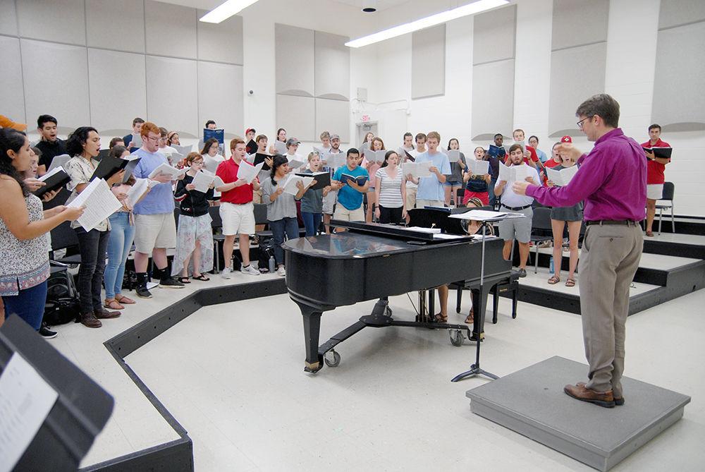Professor of Choral Music Nathan Leaf directs the State Chorale in Price Music Center on Thursday, Sept. 28, 2017. As the "premiere choral ensemble at NC State," the State Chorale draws from the more experienced talent of the men's and women's choirs. Professor Leaf directs all NC State choral ensembles including State Chorale as well as Vox Accalia Women's Choir and the Singing Statesmen Men's Choir.