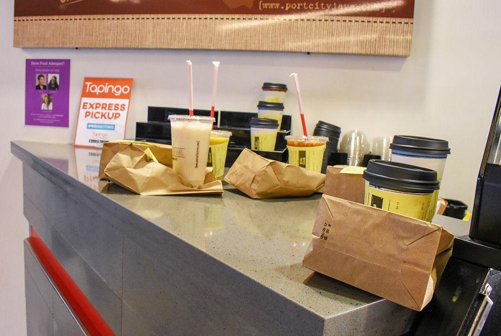 Tapingo orders sit on the Tapingo Express Pickup counter at Port City Java in Talley Student Union on Monday. Tapingo is a mobile ordering app that allows students to place orders at certain NC State Dining locations and pick them up without having to wait in line to order.