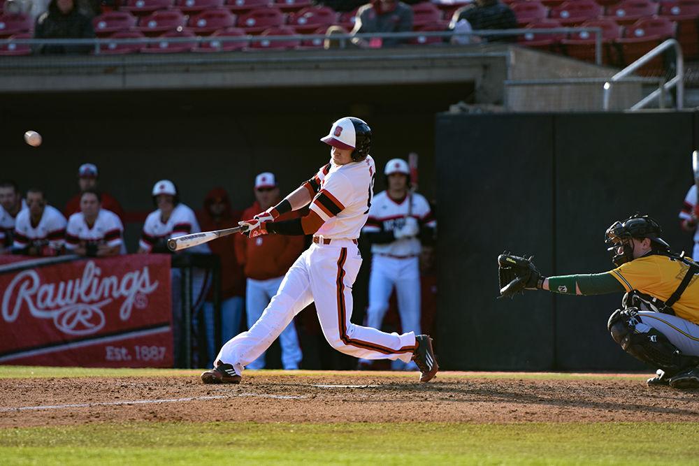 Sophomore right fielder Brock Deatherage blasts a pitch from a Wright State pitcher in the Wolfpack's 10-8 loss on Feb. 26, 2016. Deatherage posted one RBI in two at-bats in the loss at Doak Field.