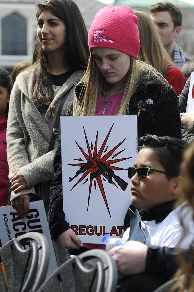 Protesters hold signs and listen to the protest speakers at the "March for Our Lives" in downtown Raleigh on Saturday, March. 24, 2017. The protest called for "common sense gun reform" in the wake of the multitude of mass shootings that have taken place in the United States school system.