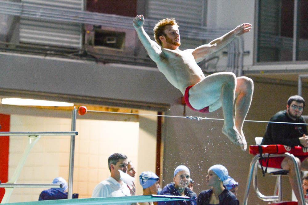 Sophomore Stewart Spanbauer does a reverse two and a half tuck off of the diving board. The NC State men's and women's swimming teams beat Carolina in 26 of 32 events at Willis R. Casey Aquatic Center on Jan. 27.